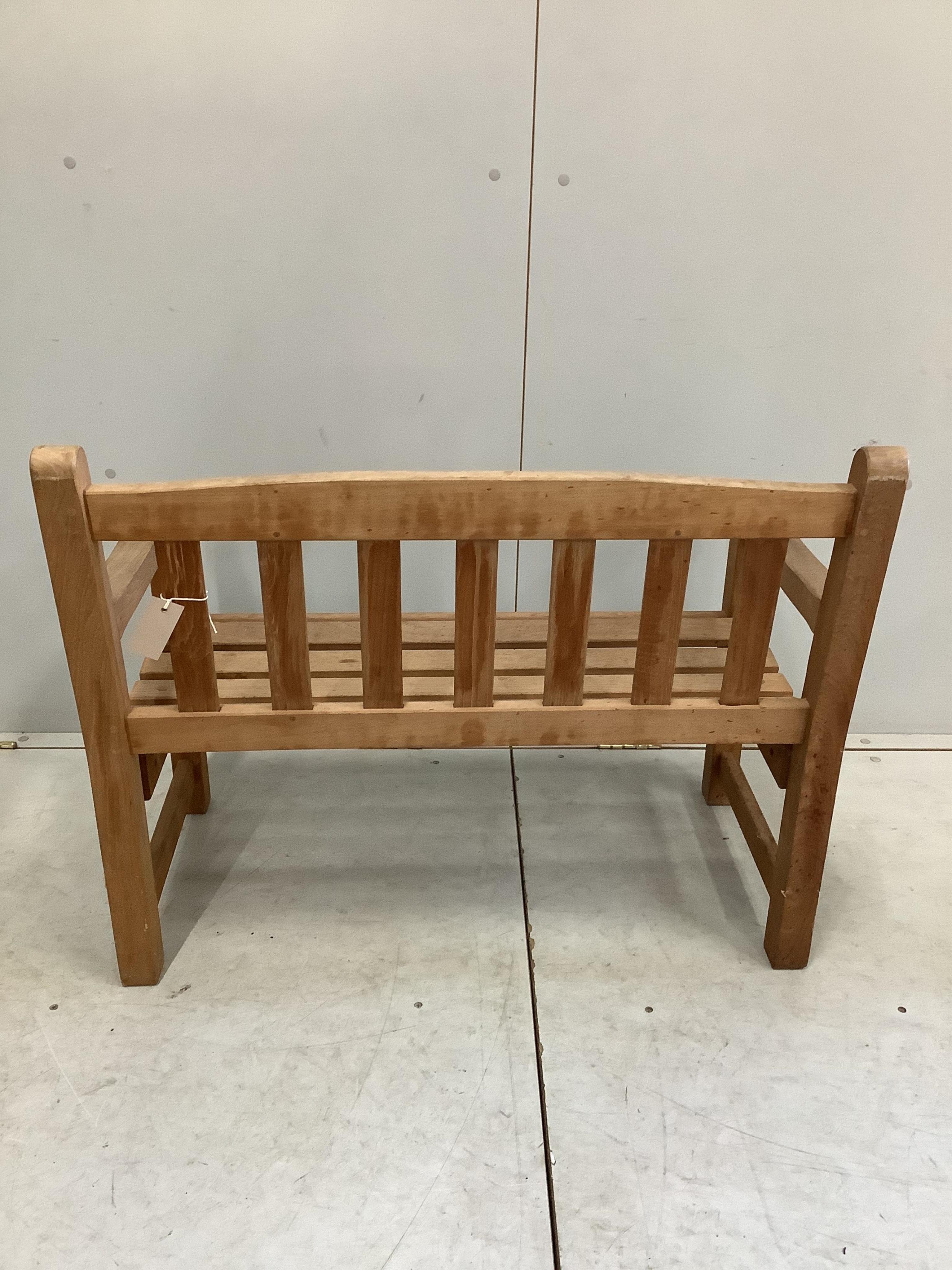 A child's teak garden bench, width 86cm, depth 47cm, height 68cm. Condition - good